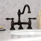 Restoration Two-Handle 3-Hole Deck Mount Bridge Bathroom Faucet with Brass Pop-Up